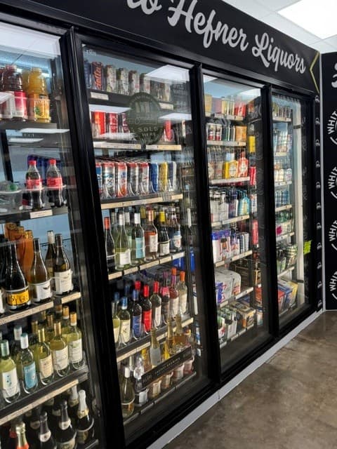 Wall of coolers stocked with beer and wine