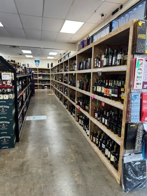 Wine and spirits aisle at Hefner Liquors